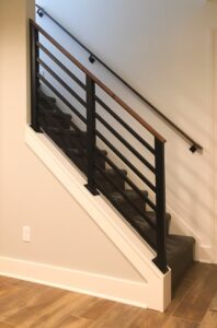 metal stair railing with wood handrail