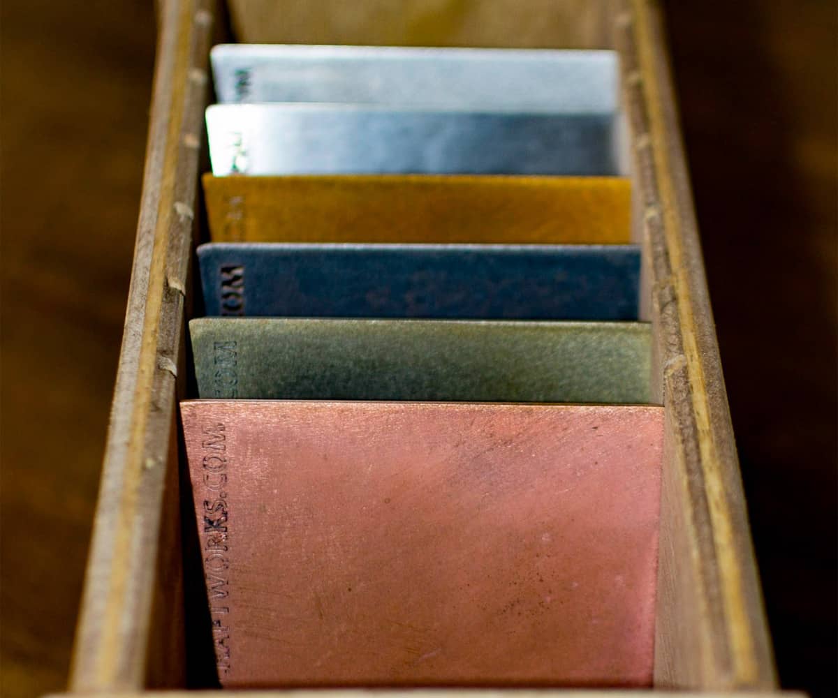 swatches of metal finishes in a box